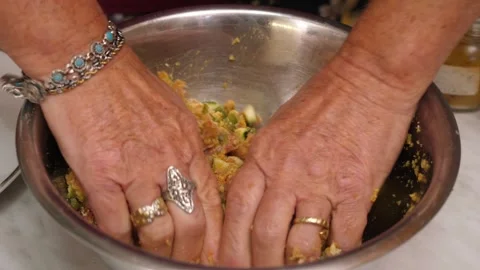 Hands mixing meat, vegetables and eggs for homemade meatballs Stock Footage 320057152
