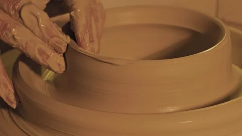 Hands mold a vase of clay Stock Footage 252889427