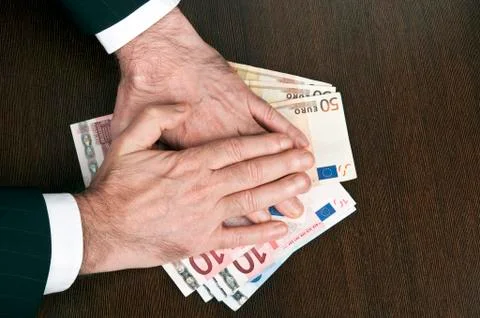 Hands on money Stock-Fotos