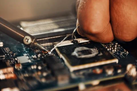 Hands, motherboard soldering and man repair hardware circuit, electronics or Stock Photos