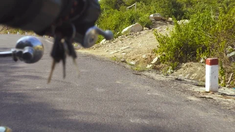 Hands motorcyclist on handlebar of motorcycle while driving on road. Man Stock Footage 100577379