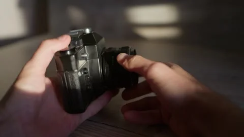 Hands Mounting and Adjusting Vintage Optics on Retro Slr Body Close-Up Stock Footage 347533053