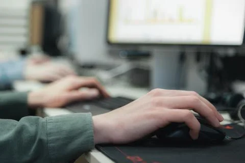 Hands on mouse and keyboard of  two  coding programmers in the it-office, clo Stock-Fotos