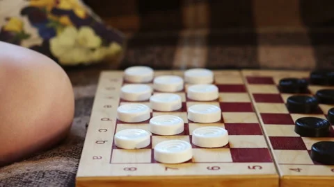 Hands move checkers on the Board Stock Footage 90052020