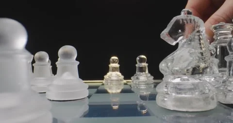 Hands moving chess piece on chess board game, macro probe lens shot, concept  Stock Footage 263599553