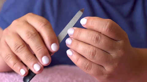 In the hands of a nail file 4K Stock Footage 156530679