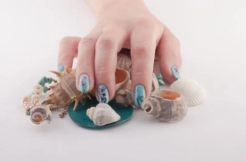 Hands, nail, spa and shells Stock Photos