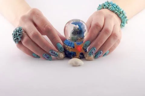 Hands, nail,manicure painted and shells Stock Photos