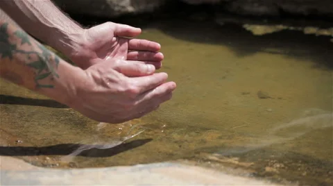 Hands in natural stone pool Video stock 51054662