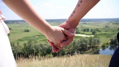 The hands of the newlyweds . Stock Footage 81812524