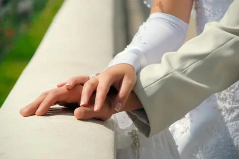 Hands newlyweds Stock Photos