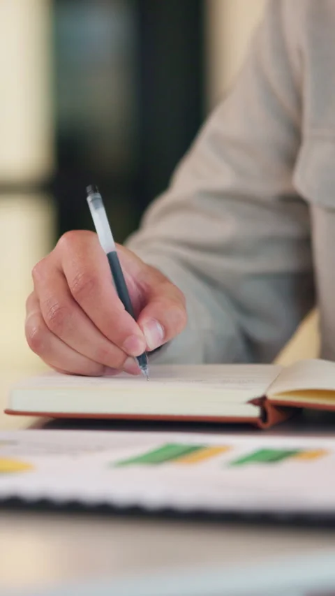 Hands, notebook and person writing for business planning, agenda or financial Stock Footage 335791685