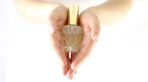 Hands Offering elegant perfume bottle Stock Footage 34865855