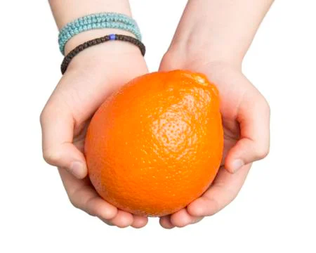 Hands Offering an Orange Stock Photos