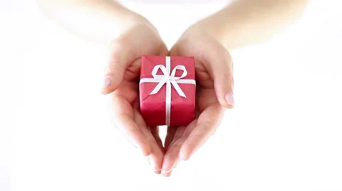 Hands Offering red gift box with white ribbon Stock Footage 34865978