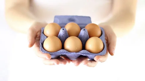 Hands Offering six fresh eggs Stock Footage 34865775