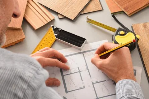Hands in office developing interior project with wood detail Stock Photos