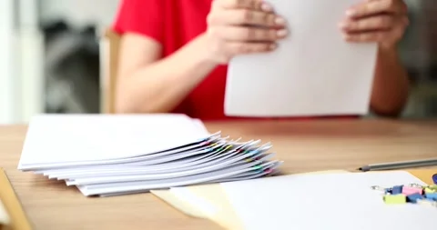 Hands in office holds a stack of white sheets paper Stock Footage 257550266