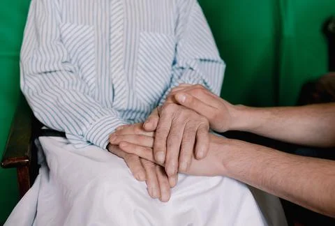 Hands of an old and young man close-up. old age and youth Stock Photos