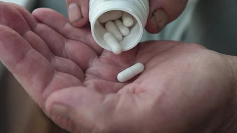 Hands Of Old Ill Man Takes Out Pull From Bottle On Palm Stock Footage 275712912