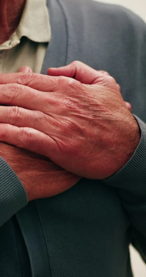 Hands, old man and stress in home with chest pain, heart attack or symptoms of 库存影片 339129652