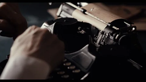 The hands of an old man are typing on an old typewriter, a writer's antique Stock Footage