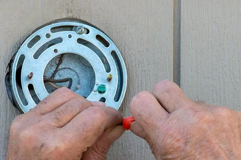 Hands of an Older man doing electrical work Stock Photos