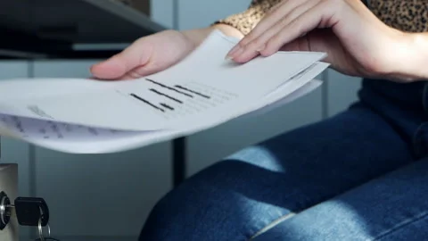 Hands open the closet and take information on a top secret document containing Stock Footage 161184987