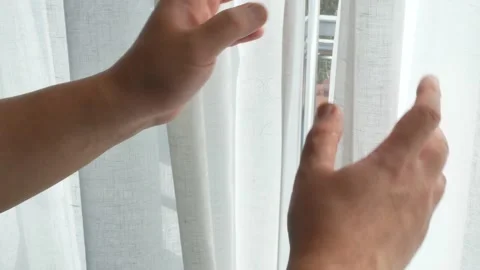 Hands open curtain with window and sunshine Stock Footage 143789114