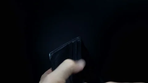 Hands open an empty wallet with one dollar in 4K Stock Footage 139229260