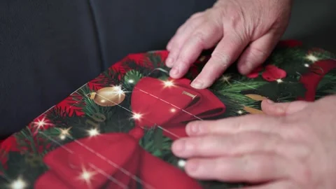 Hands open the first window on a festive advent calendar revealing holiday  Stock Footage 321650483
