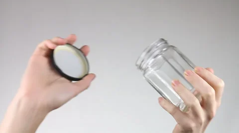 Hands open a glass jar. Stock Footage 60402287