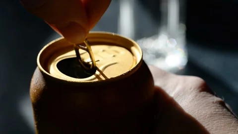 Hands open golden iron can of beer Stock Footage