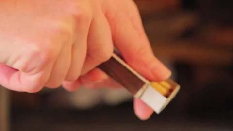 Hands open match box and burn up match Stock-Footage 99460130