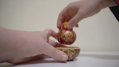 Hands open the matryoshka doll. Stock Footage 320573416