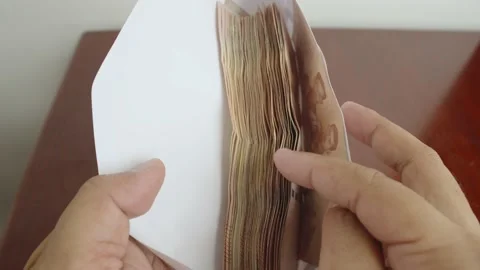 Hands open white envelope and counting cash money. Stock Footage 237509439