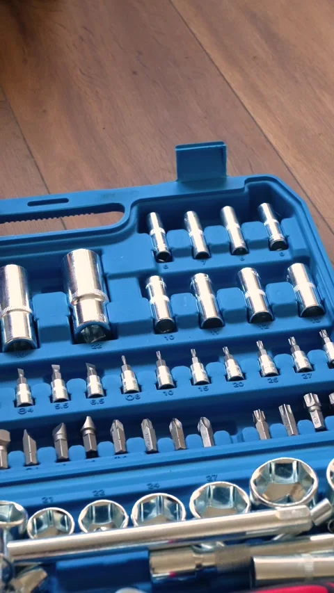 Hands opening a blue plastic toolbox with a professional socket wrench Stock Footage 346234837