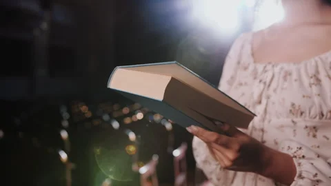 Hands Opening Book in Empty Theater Hall. Search for Knowledge Concept Vídeos de archivo 336452480