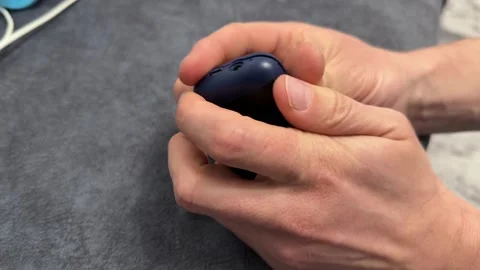 Hands opening case of old button mobile phone close up, vintage electronics Stock Footage 337121260