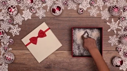 Hands opening christmas present and drawing xmas tree 스톡 동영상 81023134