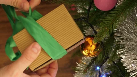 Hands opening christmas present gift medical finger pulsoxymeter inside Stock Footage 152664659