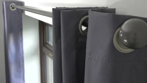 Hands opening a pair of room curtains. Video stock 165557575
