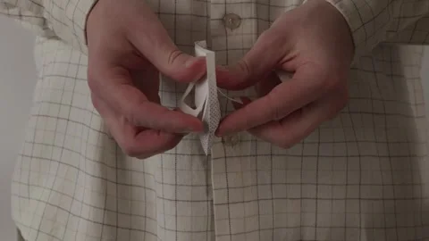 Hands opening a paper drip coffee filter bag closeup Stock Footage 335143398