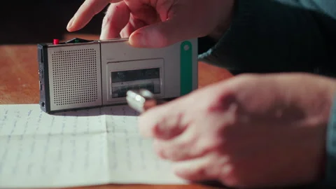 Hands Operating Dictaphone and Timing Recording with Watch Stock Footage 332076334