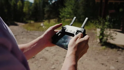 Hands operating drone remote controller close up Stock-Footage 348020993