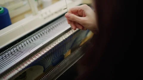 Hands operating knitting machine, close up motion of yarn and needles creat.. Stock Footage 339755211