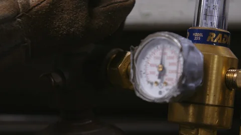 Hands operating pressure gauge with an emergency pressure relief valve Stock Footage 117724754