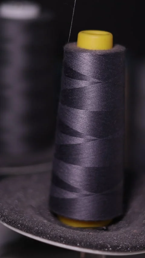 Hands operating sewing machine. Craftsmanship in textile production. Stock Footage 279724856