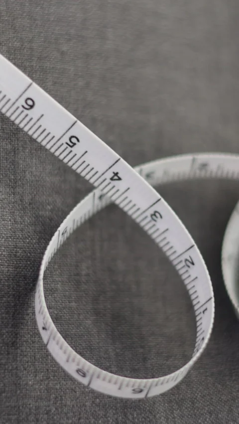 Hands operating sewing machine. Craftsmanship in textile production. Stock Footage 279724871