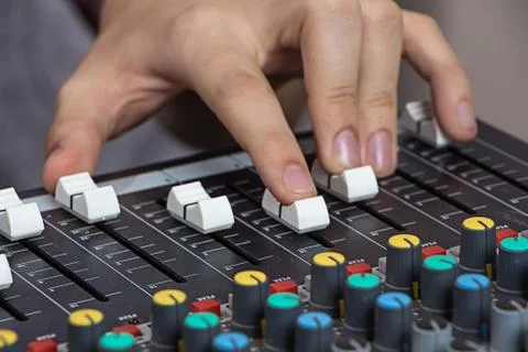 Hands operating sound console Stock Photos